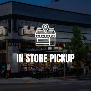 Storefront with 'In Store Pickup' sign and people outside