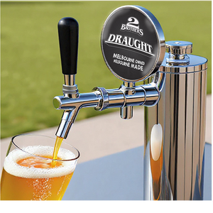 Brothers Draught beer tap pouring beer into a glass with a blurred green background