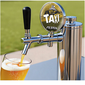 Beer tap with 'Two Brothers Taxi Pilsner' branding, pouring beer into a glass.
